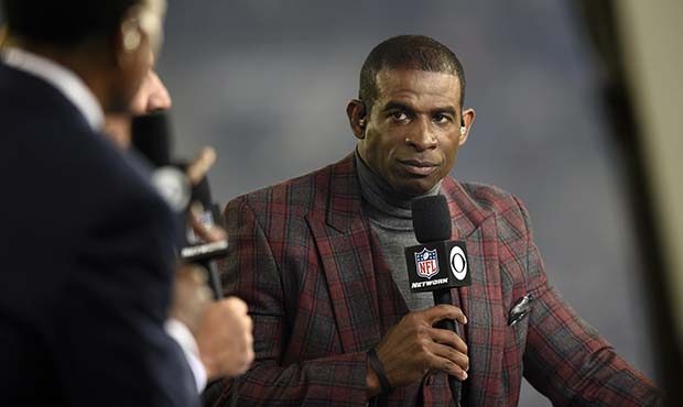 Deion Sanders speaks on the Thursday Night Football set during halftime in an NFL football game bet...
