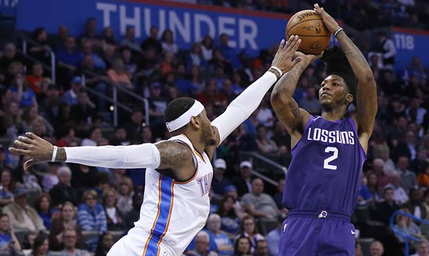 Phoenix Suns guard Elfrid Payton (2) shoots as Oklahoma City Thunder forward Carmelo Anthony defend...