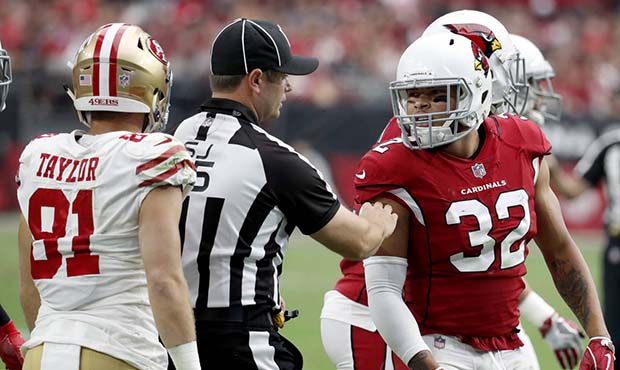 Arizona Cardinals free safety Tyrann Mathieu (32) is pulled away from San Francisco 49ers wide rece...