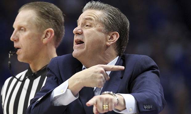 Kentucky coach John Calipari gestures to his team during the second half of an NCAA college basketb...