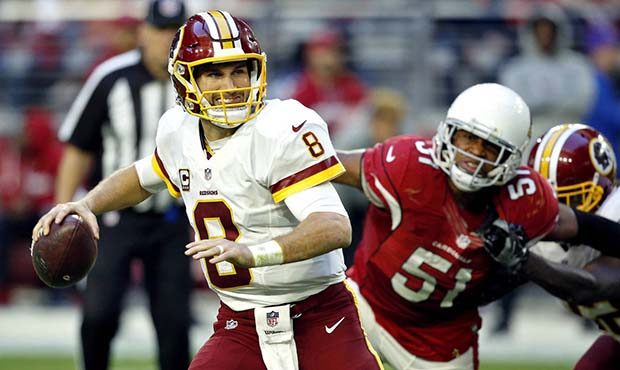 Washington Redskins quarterback Kirk Cousins (8) looks to throw as Arizona Cardinals middle linebac...