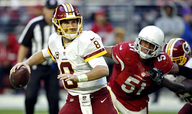Washington Redskins quarterback Kirk Cousins (8) looks to throw as Arizona Cardinals middle linebacker Kevin Minter (51) pursues during the second half of an NFL football game, Sunday, Dec. 4, 2016, in Glendale, Ariz. (AP Photo/Ross D. Franklin)