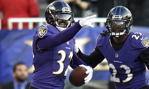 Baltimore Ravens free safety Eric Weddle, left, celebrates with teammate Tony Jefferson after runni...