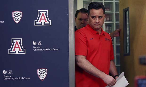 Arizona NCAA college basketball coach Sean Miller arrives for a press conference in Tucson, Ariz., ...