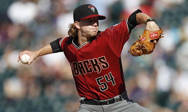 Arizona Diamondbacks relief pitcher Jimmie Sherfy delivers pitch in the eighth inning of a baseball...
