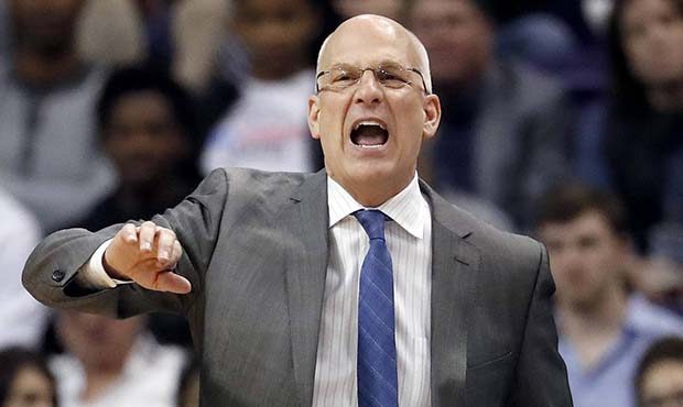 Phoenix Suns head coach Jay Triano yells during the second half of an NBA basketball game against t...