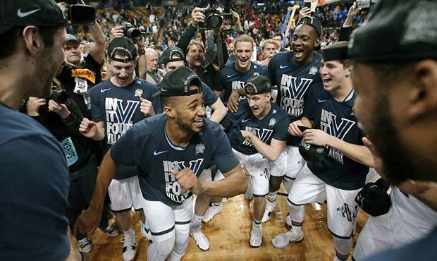 Phil Booth, center, leads Villanova players celebrating their win over Texas Tech in an NCAA men's ...