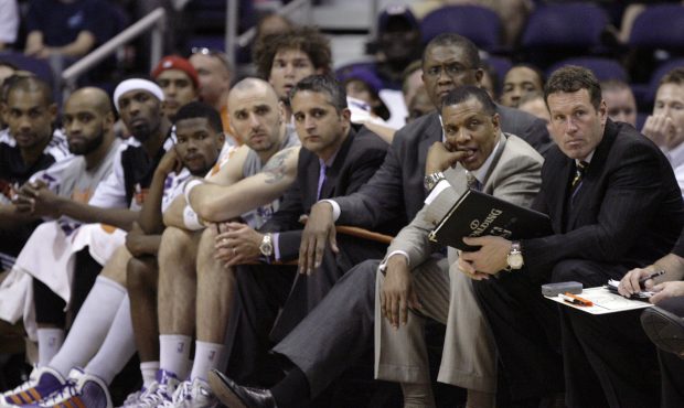 Phoenix Suns coach Alvin Gentry, second from right, along with his assistant coaches Dan Marjerle, ...