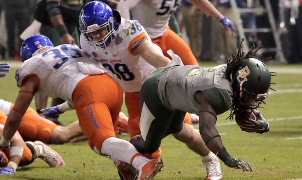 Baylor running back JaMycal Hasty scores a touchdown as Boise State linebackers Leighton Vander Esc...