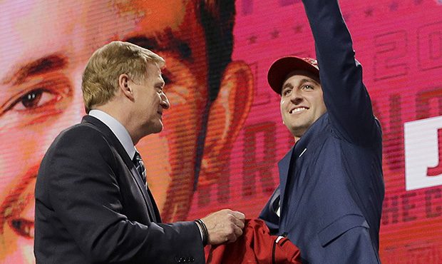 UCLA's Josh Rosen, right, gestures next to commissioner Roger Goodell after being selected by the A...