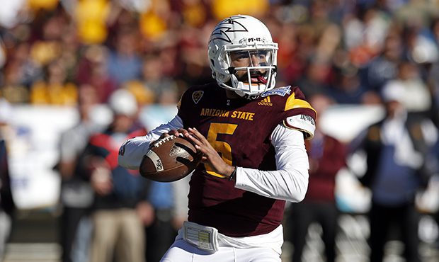 Arizona State quarterback Manny Wilkins throws against North Carolina State during the first half o...