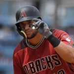 Arizona Diamondbacks' David Peralta gestures after hitting a double during the sixth inning of a baseball game against the Los Angeles Dodgers Sunday, April 15, 2018, in Los Angeles. (AP Photo/Mark J. Terrill)