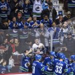 Vancouver Canucks' Troy Stecher, Daniel Sedin, Henrik Sedin, Alexander Edler and Sam Gagner, from left, celebrate Daniel Sedin's goal against the Arizona Coyotes during the second period of an NHL hockey game Thursday, April 5, 2018, in Vancouver, British Columbia. (Darryl Dyck//The Canadian Press via AP)