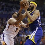 Golden State Warriors center JaVale McGee (1) draws the foul on Phoenix Suns forward Jared Dudley in the second half during an NBA basketball game, Sunday, April 8, 2018, in Phoenix. The Warriors defeated the Suns 117-100. (AP Photo/Rick Scuteri)