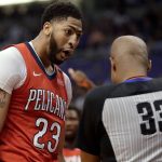 New Orleans Pelicans forward Anthony Davis (23) argues a foul call against him by referee Sean Corbin (33) during the second half of an NBA basketball game against the Phoenix Suns on Friday, April 6, 2018, in Phoenix. (AP Photo/Matt York)