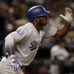 Los Angeles Dodgers Yasiel Puig hits a double in the sixth inning during a baseball game against the Arizona Diamondbacks, Tuesday, April 3, 2018, in Phoenix. (AP Photo/Rick Scuteri)