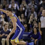Golden State Warriors' Klay Thompson reacts after making a 3-point basket against the Phoenix Suns during the second half of an NBA basketball game Sunday, April 1, 2018, in Oakland, Calif. (AP Photo/Marcio Jose Sanchez)