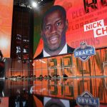 Pro Football Hall of Famer Jim Brown, left, and Commissioner Roger Goodell walk off the stage after Brown announced Georgia's Nick Chubb as a Cleveland Browns second-round pick during the second round of the NFL football draft, Friday, April 27, 2018, in Arlington, Texas. (AP Photo/Eric Gay)