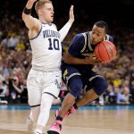 Michigan's Muhammad-Ali Abdur-Rahkman drives against Villanova's Donte DiVincenzo (10) during the second half in the championship game of the Final Four NCAA college basketball tournament, Monday, April 2, 2018, in San Antonio. (AP Photo/Eric Gay)
