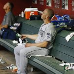 San Diego Padres starting pitcher Clayton Richard flips his cup of water as he sits in the dugout after being pulled from a baseball game during the sixth inning against the Arizona Diamondbacks, Saturday, April 21, 2018, in Phoenix. (AP Photo/Ross D. Franklin)
