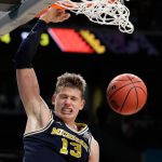 Michigan's Moritz Wagner (13) dunks during the second half in the championship game of the Final Four NCAA college basketball tournament against Villanova, Monday, April 2, 2018, in San Antonio. (AP Photo/Eric Gay)