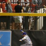 
              Los Angeles Dodgers right fielder Alex Verdugo is unable to make a catch on a ground rule double hit by Arizona Diamondbacks' Zack Greinke during the fourth inning of a baseball game Monday, April 30, 2018, in Phoenix. (AP Photo/Ross D. Franklin)
            