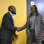 Pittsburgh Steelers first-round NFL football draft pick Terrell Edmunds, right, shakes hands with coach Mike Tomlin after a news conference at the team's headquarters in Pittsburgh, Friday, April 27, 2018. (AP Photo/Fred Vuich)