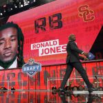 Former player Ronde Barber walks off the stage after announcing Southern California's Ronald Jones as the New York Giants' pick during the second round of the NFL football draft, Friday, April 27, 2018, in Arlington, Texas. (AP Photo/Eric Gay)