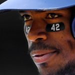 Los Angeles Dodgers' Yasiel Puig stands on first while wearing the number 42 under his eyes to commemorate Jackie Robinson day during the third inning of a baseball game against the Arizona Diamondbacks Sunday, April 15, 2018, in Los Angeles. (AP Photo/Mark J. Terrill)