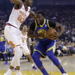 Golden State Warriors' Draymond Green, right, is defended by Phoenix Suns' Josh Jackson during the first half of an NBA basketball game Sunday, April 1, 2018, in Oakland, Calif. (AP Photo/Marcio Jose Sanchez)
