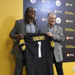 Pittsburgh Steelers first-round NFL football draft pick Terrell Edmunds, left, and owner Art Rooney II hold up a jersey after a news conference at the team's headquarters in Pittsburgh, Friday, April 27, 2018. (AP Photo/Fred Vuich)