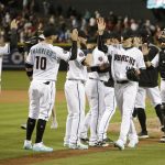 Arizona Diamondbacks starting pitcher Patrick Corbin (46) celebrates with teammates after pitching a complete game, one hit shut-out against the San Francisco Giants during a baseball game, Tuesday, April 17, 2018, in Phoenix. (AP Photo/Rick Scuteri)