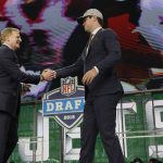 Commissioner Roger Goodell, left, greets USC's Sam Darnold after he was selected by the New York Jets during the first round of the NFL football draft, Thursday, April 26, 2018, in Arlington, Texas. (AP Photo/David J. Phillip)