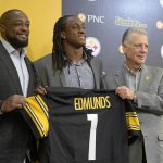 Pittsburgh Steelers coach Mike Tomlin, left, first-round NFL football draft pick Terrell Edmunds, center, and owner Art Rooney II hold up a jersey after a news conference at the team's headquarters in Pittsburgh, Friday, April 27, 2018. (AP Photo/Fred Vuich)