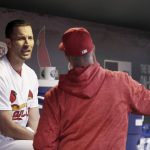 St. Louis Cardinals starting pitcher Adam Wainwright, left, talks in the dugout with pitching coach Mike Maddux during the third inning of a baseball game against the Arizona Diamondbacks, Thursday, April 5, 2018, in St. Louis. (AP Photo/Jeff Roberson)
