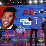 Penn State's Saquon Barkley poses after being selected by the New York Giants during the first round of the NFL football draft, Thursday, April 26, 2018, in Arlington, Texas. (AP Photo/David J. Phillip)
