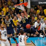 Michigan's Moritz Wagner (13) dunks during the second half in the championship game of the Final Four NCAA college basketball tournament against Villanova, Monday, April 2, 2018, in San Antonio. (AP Photo/Brynn Anderson)