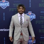 LSU's Derrius Guice poses for photos on the red carpet during the first round of the NFL football draft, Thursday, April 26, 2018, in Arlington, Texas. (AP Photo/Eric Gay)