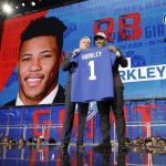 Penn State's Saquon Barkley, right, poses with commissioner Roger Goodell after being selected by the New York Giants during the first round of the NFL football draft, Thursday, April 26, 2018, in Arlington, Texas. (AP Photo/David J. Phillip)