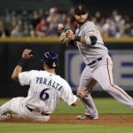 San Francisco Giants' Brandon Crawford forces out Arizona Diamondbacks David Peralta (6) as he tries to throw out Ketel Marte during the third inning of a baseball game Thursday, April 19, 2018, in Phoenix. Marie was safe at first. (AP Photo/Matt York)