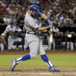 Los Angeles Dodgers Chris Taylor hits a sacrifice RBI fly out against the Arizona Diamondbacks in the third inning during a baseball game, Tuesday, April 3, 2018, in Phoenix. (AP Photo/Rick Scuteri)