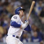 Los Angeles Dodgers' Cody Bellinger watches his home run during the sixth inning of the team's baseball game against the Arizona Diamondbacks, Friday, April 13, 2018, in Los Angeles. (AP Photo/Jae C. Hong)