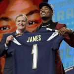 Commissioner Roger Goodell, left, presents Florida State's Derwin James with his Los Angeles Chargers jersey during the first round of the NFL football draft, Thursday, April 26, 2018, in Arlington, Texas. (AP Photo/David J. Phillip)