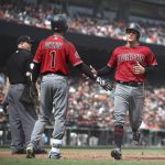 Arizona Diamondbacks' John Ryan Murphy, right, is congratulated by Jarrod Dyson (1) as he scores against the San Francisco Giants in the seventh inning of a baseball game Wednesday, April 11, 2018, in San Francisco. (AP Photo/Ben Margot)