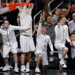 Players on Villanova bench react to a 3-point basket during the second half in the championship game of the Final Four NCAA college basketball tournament against Michigan, Monday, April 2, 2018, in San Antonio. (AP Photo/Brynn Anderson)