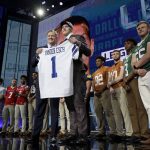 Commissioner Roger Goodell, center left, presents Boise State's Leighton Vander Esch with his Dallas Cowboys team jersey during the first round of the NFL football draft, Thursday, April 26, 2018, in Arlington, Texas. (AP Photo/David J. Phillip)