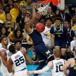 Michigan's Charles Matthews dunks during the second half in the championship game of the Final Four NCAA college basketball tournament against Villanova, Monday, April 2, 2018, in San Antonio. (AP Photo/Brynn Anderson)
