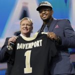 Commissioner Roger Goodell, left, presents UTEP's Marcus Davenport with his New Orleans Saints jersey during the first round of the NFL football draft, Thursday, April 26, 2018, in Arlington, Texas. (AP Photo/David J. Phillip)
