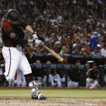 Arizona Diamondbacks' Zack Godley connects for a run-scoring single against the San Diego Padres during the second inning of a baseball game Saturday, April 21, 2018, in Phoenix. (AP Photo/Ross D. Franklin)