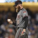 Arizona Diamondbacks relief pitcher Archie Bradley stands on the mound after giving up a two-run single to Los Angeles Dodgers' Chase Utley during the eighth inning of a baseball game, Friday, April 13, 2018, in Los Angeles. (AP Photo/Jae C. Hong)